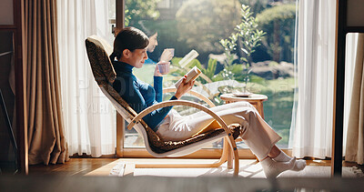 Buy stock photo Reading, coffee and Asian woman with book, morning and knowledge with literature, relax and weekend. Home, tea and person with novel, rest and comfortable with story, break and cozy on chair or Japan