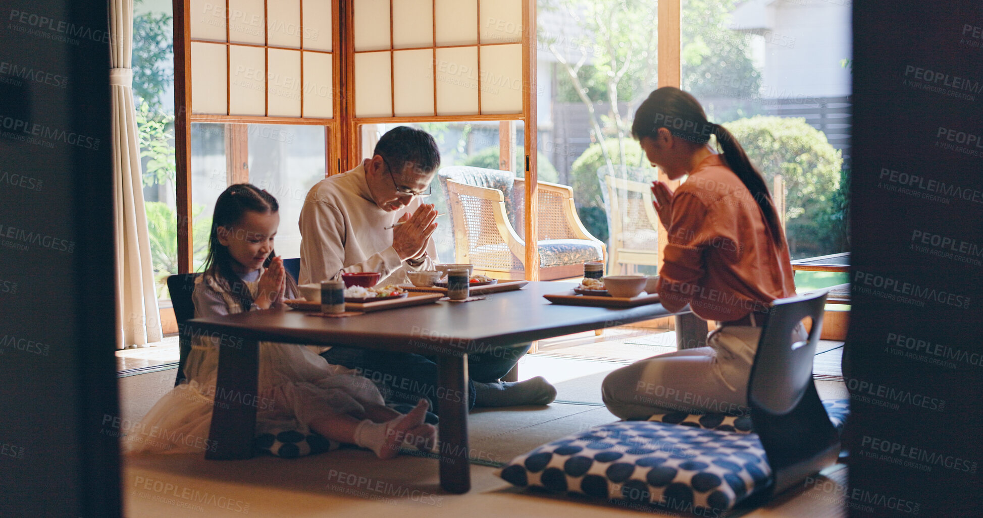 Buy stock photo Japan, home and family with food, bow and parents with healthy meal, protein and culture. Apartment, mother and father with daughter, Asian cuisine and pray for nutrition, gratitude and respect