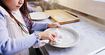 Hands, child and wipe dishes in kitchen for cleaning routine, learning hygiene and helping with housework. Girl, wash plates and parent for teaching responsibility, disinfect germs and house in Japan