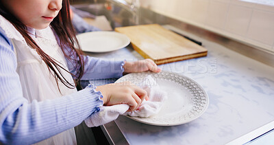 Buy stock photo Hands, child and wipe dishes in kitchen for cleaning routine, learning hygiene and helping with housework. Girl, wash plates and parent for teaching responsibility, disinfect germs and house in Japan