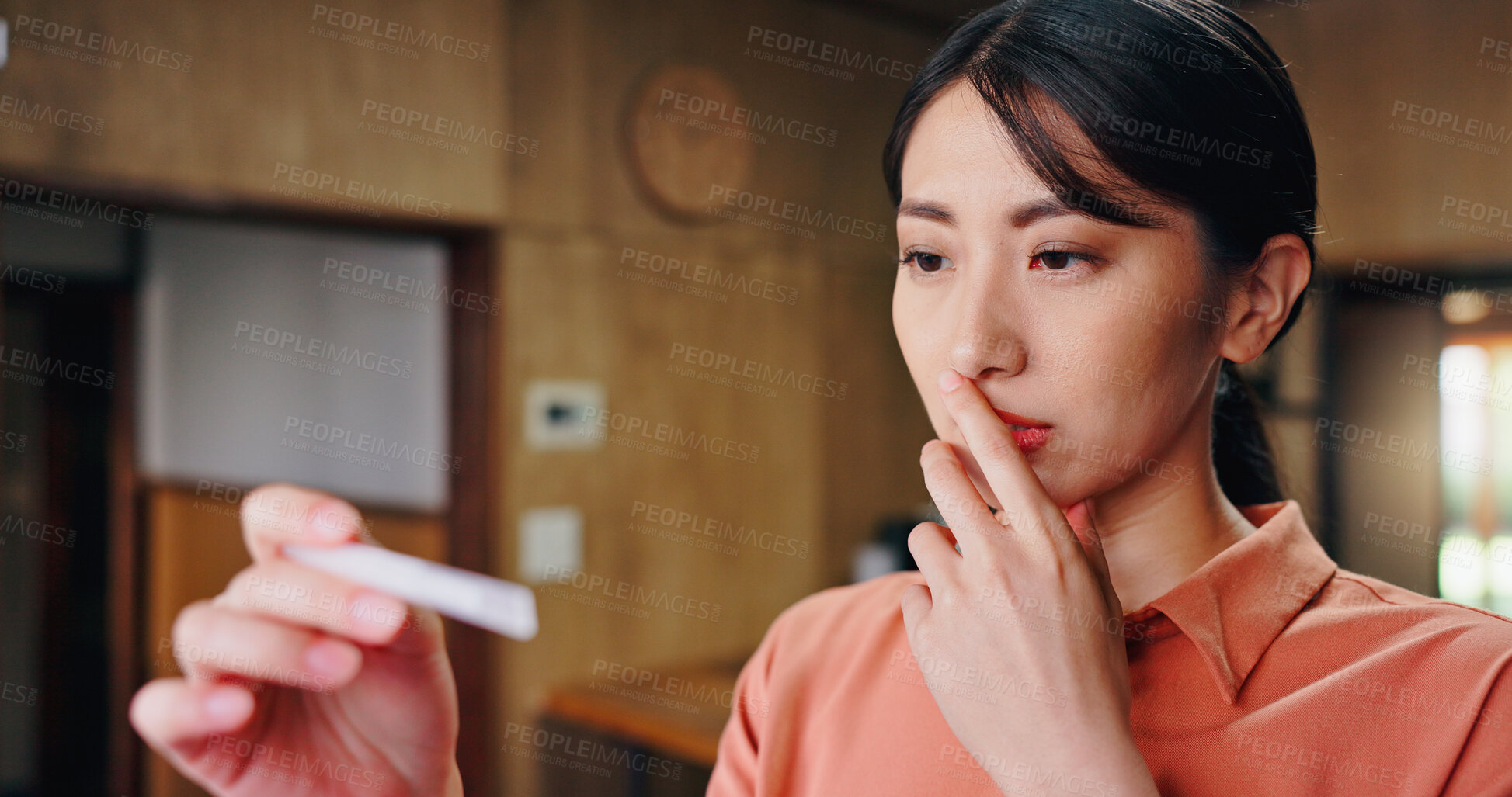 Buy stock photo Japanese woman, pregnancy test and worry, fear or anxiety in house for results or surprise news. Female person, shock and stress as future mother in living room for thinking, fertility or home