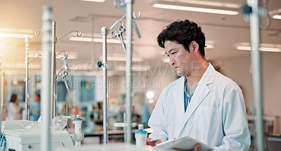 Buy stock photo Technician, tablet and science with Japanese man in laboratory for equipment, research study and healthcare. Dialysis machine, biotechnology and solution with person in clinic for medical results