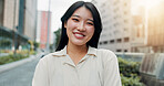 Japanese woman, portrait and smile in city for sightseeing, walk and proud for travel. Female pedestrian, street and confidence in town for adventure, location or experience as tourist on holiday