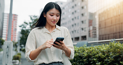 Buy stock photo Phone, vacation and woman in city for communication, networking or typing email for travel. Cellphone, contact and Japanese female person reading online blog for holiday tips or advice in town.