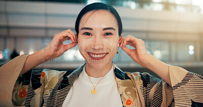 Buy stock photo Earphones, music and portrait of Asian woman in city for media, streaming subscription and radio in Japan. Happy, smile and face of person listening to audio, song and track at night in urban town