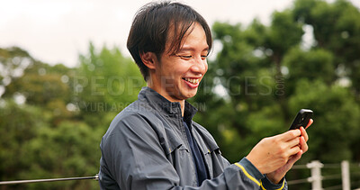 Buy stock photo Phone, happy and man outdoor typing email for contact, communication or social networking. Smile, technology and Japanese male person on cellphone for research, connectivity or online media in city.