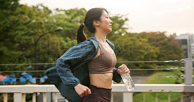 Buy stock photo Japanese woman, running and exercise in city of sport fitness, marathon training and workout practice. Female athlete, cardio and physical activity of endurance performance, wellness and Japan bridge