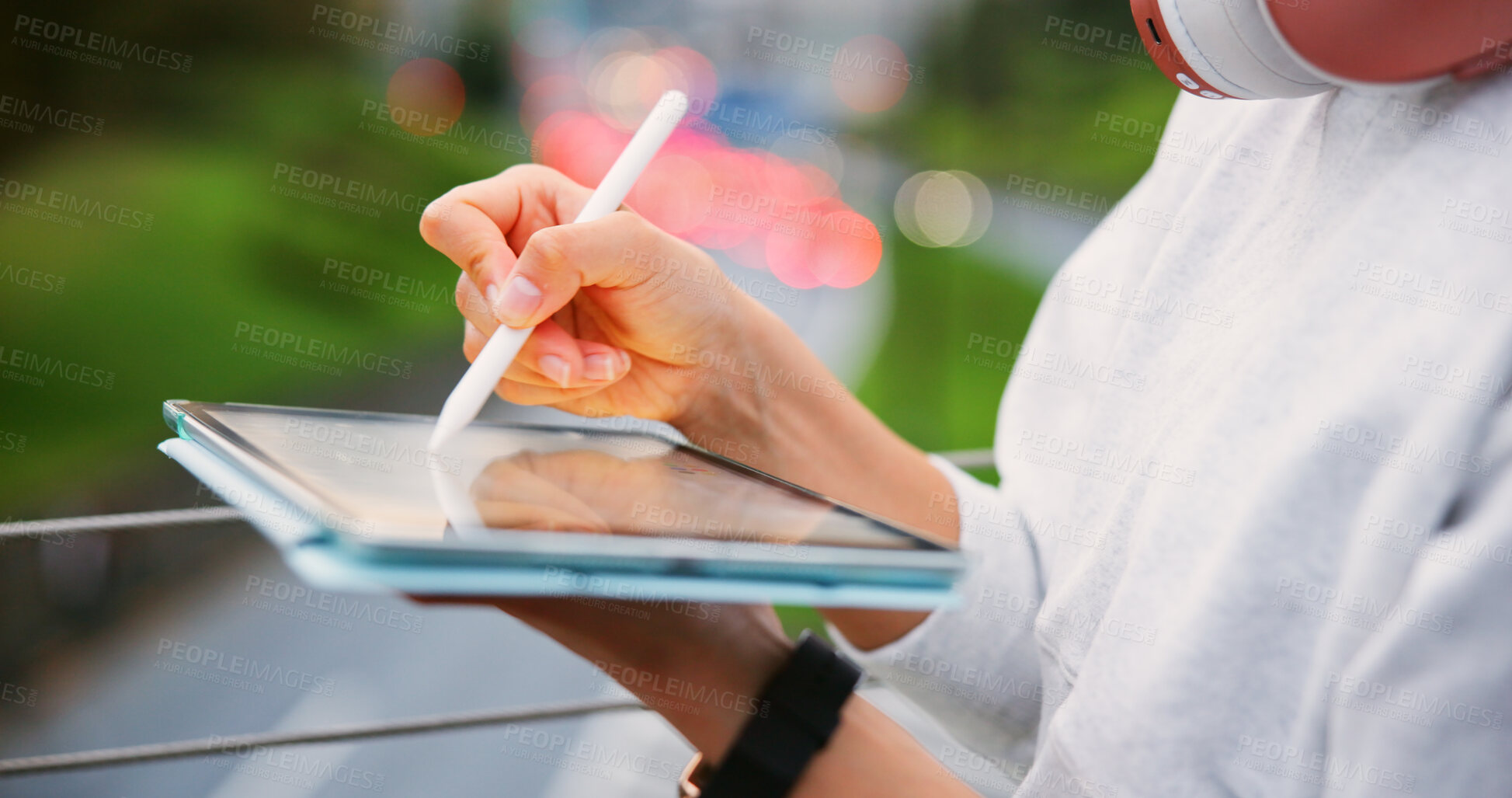 Buy stock photo Hands, person and writing on tablet in urban for copywriting, article manuscript and publishing post. Writer, headphones and pen with newsletter blog, editing update and story project on Japan bridge