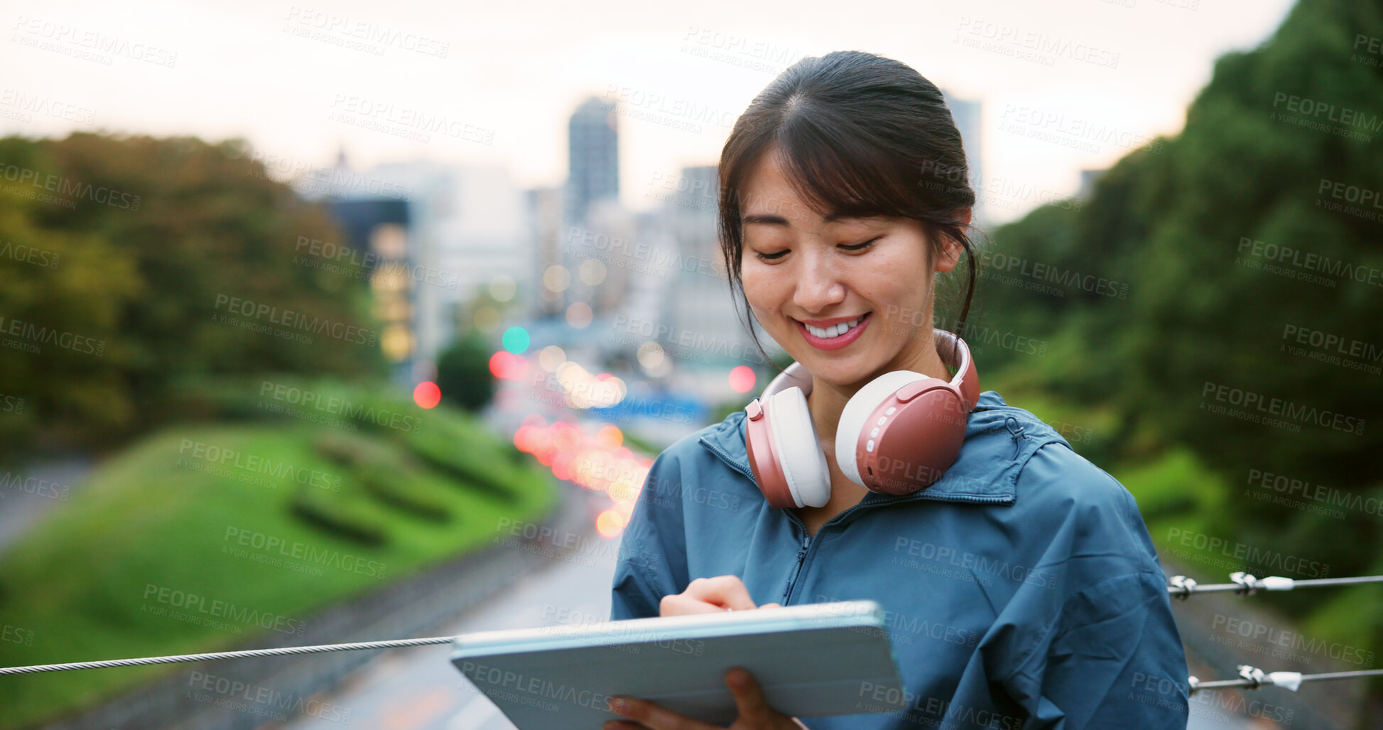 Buy stock photo Japanese woman, drawing and tablet in city for graphic design, digital illustration and creative process. Female artist, headphones and writing for website, editing update and project on Japan bridge