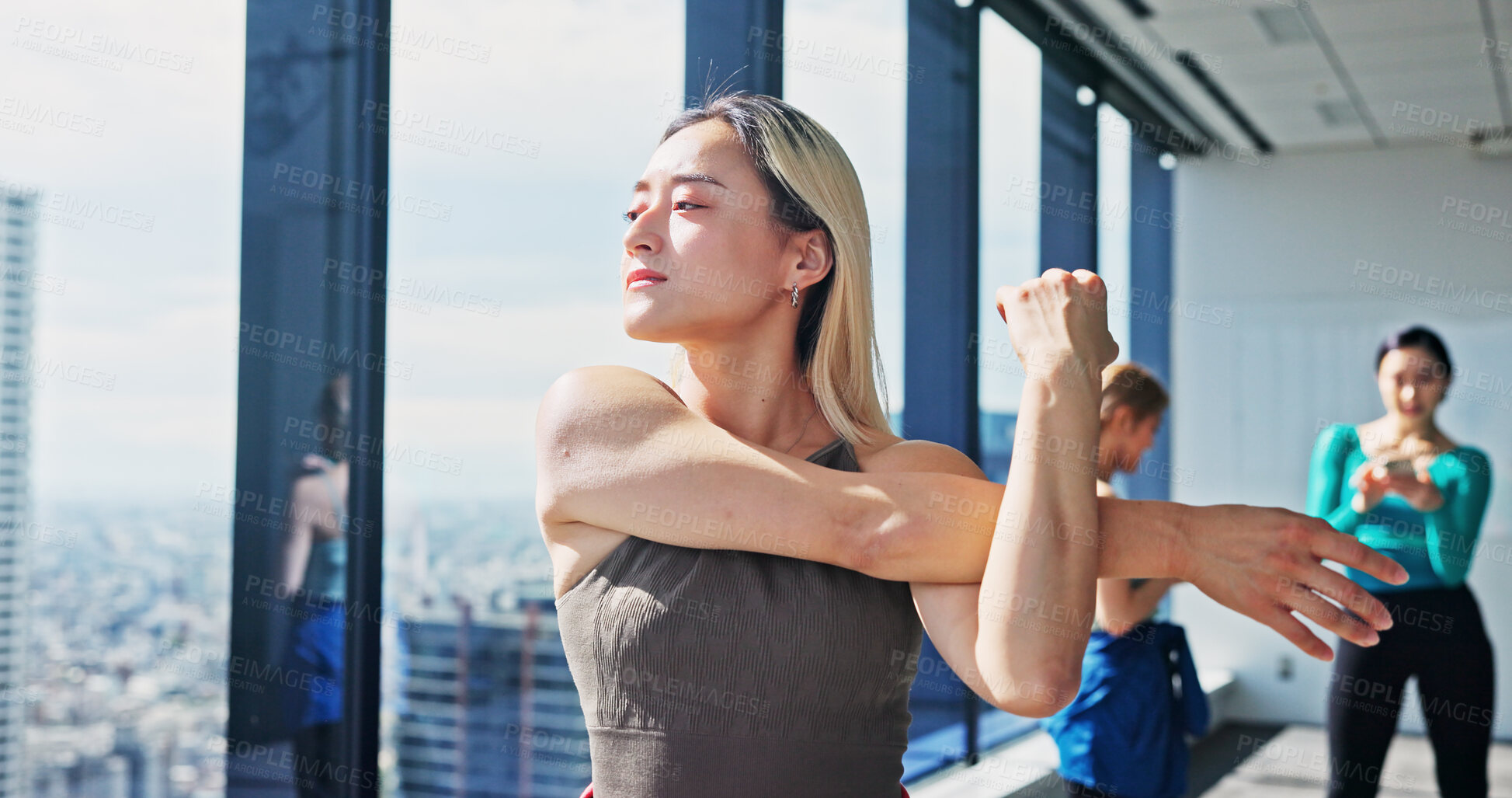 Buy stock photo Warm up, Japanese woman and arms stretching in dance studio for practice, training and choreography in ballet. Fitness, muscle flexibility and dancer for company, theater and performance art school