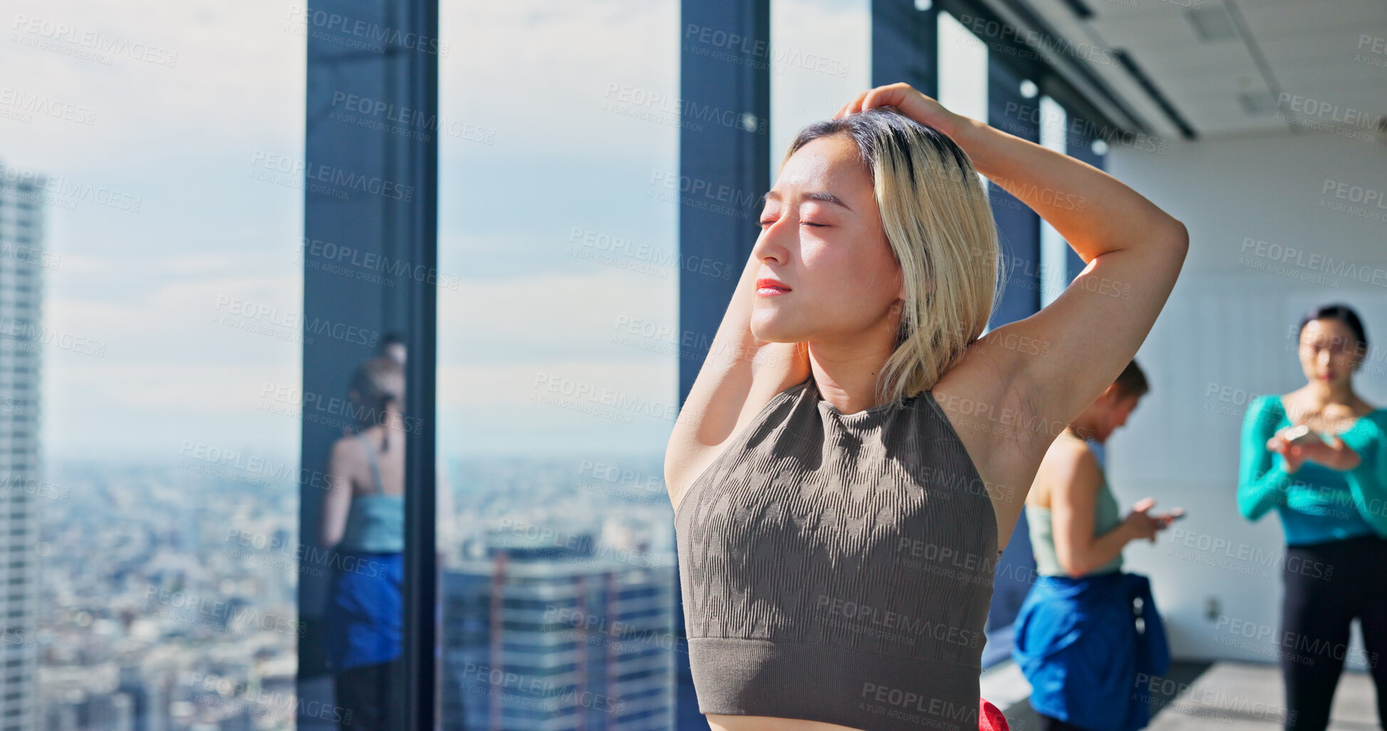 Buy stock photo Warm up, Japanese woman and stretching for practice, training and choreography in ballet dance studio. Fitness, arm muscle flexibility and dancer for company, theater and performance art school