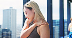 Exercise, injury and shoulder pain with Japanese woman at gym for recovery or rehabilitation. Fitness, health and wellness with athlete massaging joint for relief from discomfort or strain in Japan