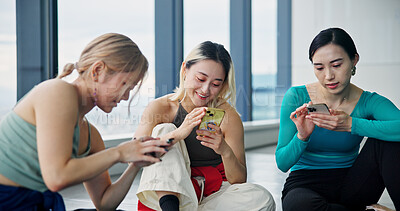 Buy stock photo Phone, group and women in dance studio with networking, communication or browsing social media. Happy, cellphone and Japanese ballerinas watching online video for classic technique at rehearsal.