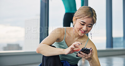 Buy stock photo Phone, smile and woman in dance studio with networking, communication or browsing social media. Happy, cellphone and Japanese ballerina watching online video for classic technique at rehearsal.