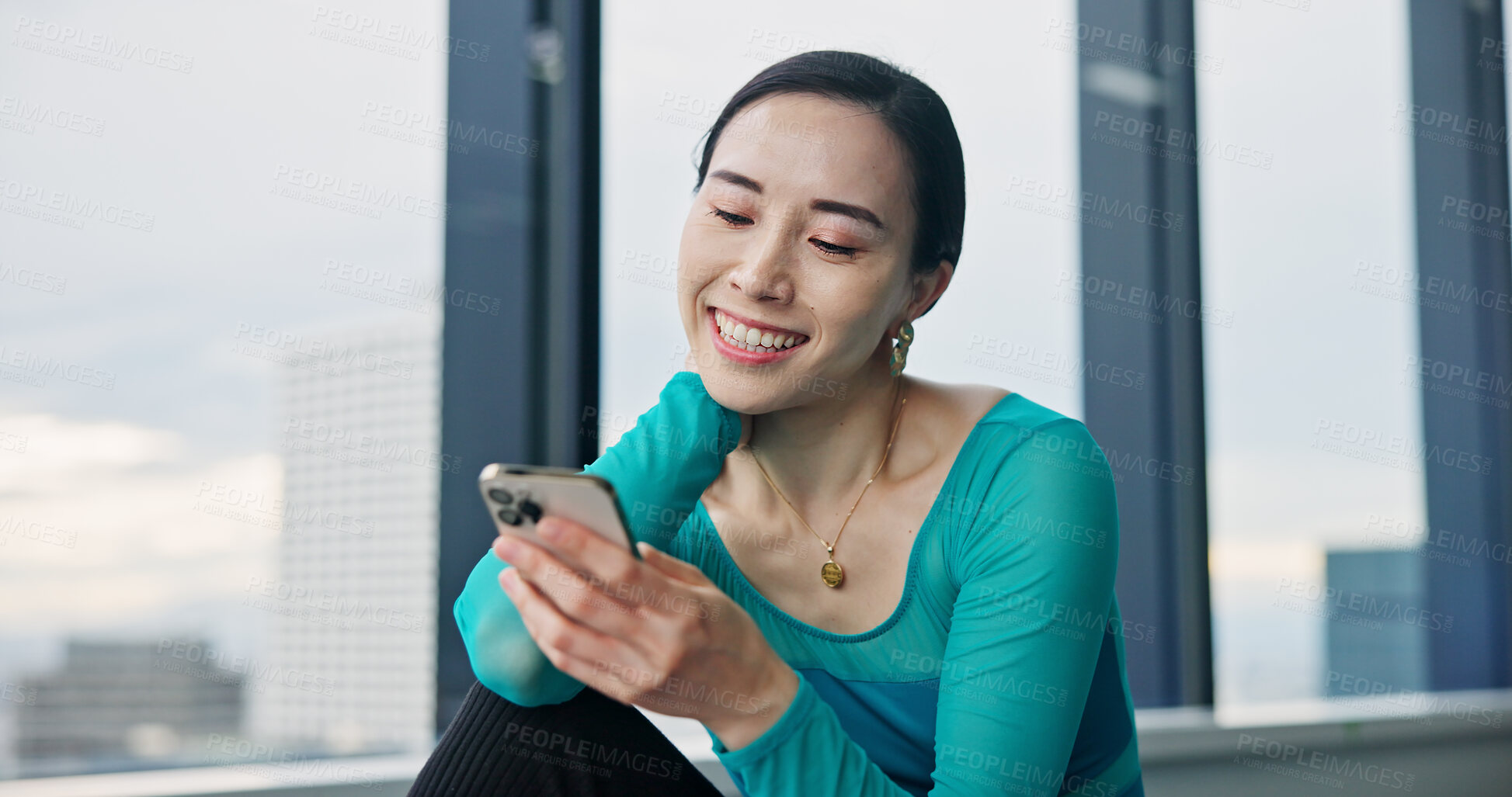 Buy stock photo Phone, happy and Japanese woman in dance studio with networking, communication or browsing social media. Smile, cellphone and female ballerina watching online video for classic technique at rehearsal