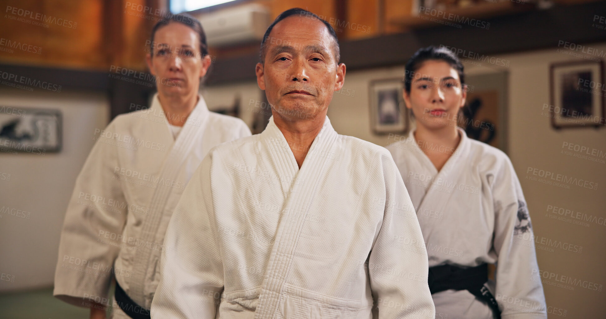 Buy stock photo Martial arts, aikido and japanese people in portrait for self defense, respect or cultural honor in dojo. Serious sensei, group or together in class for fighting practice, discipline or demonstration