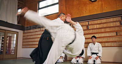 Buy stock photo Martial arts, flip demonstration and Japanese sport with learning, exercise and karate etiquette in dojo. Japan, training and fight studio with master, discipline and warrior in taekwondo class