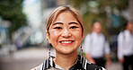 Smile, portrait and Japanese businesswoman in city with positive attitude for finance career. Happy, confident and face of female financial executive with pride for company revenue in urban town.