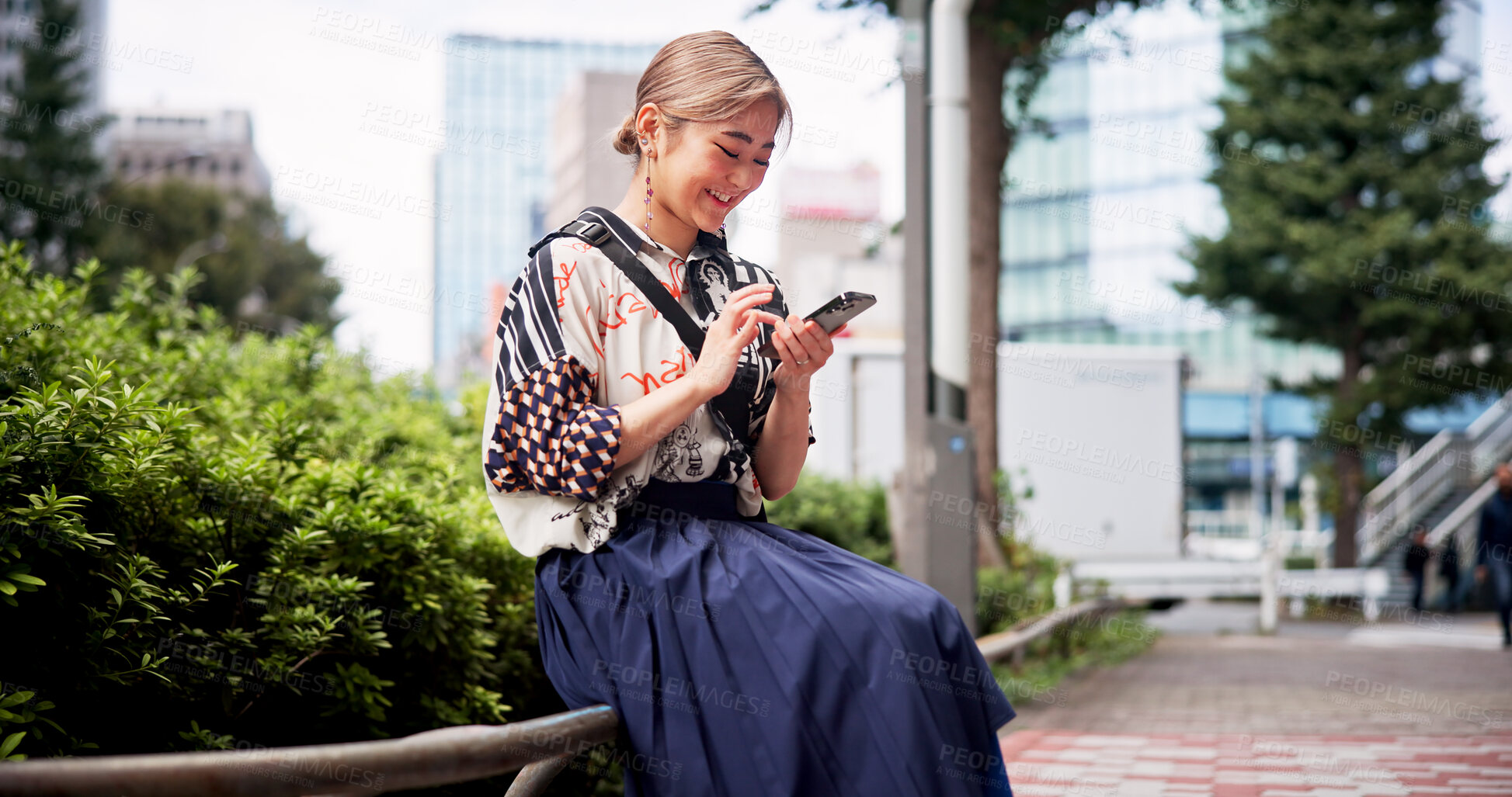Buy stock photo Japanese, woman and park with phone for social media, online communication and search location. City, female person and happy with mobile application for chat, travel and navigation for map in Tokyo