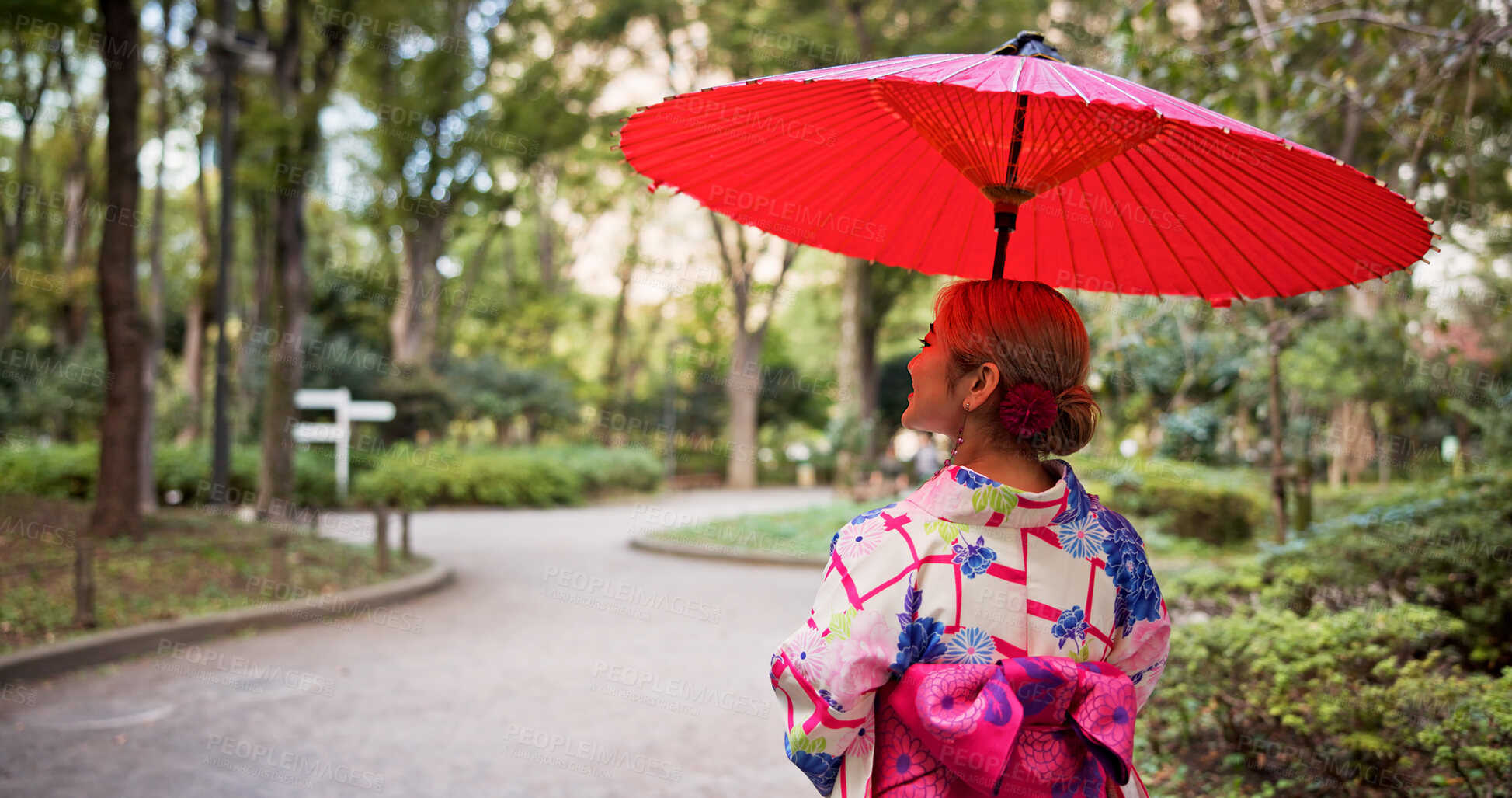 Buy stock photo Kimono, umbrella and walking with woman in park to explore green location for sightseeing or tourism. Back, fashion and travel with person outdoor in nature of Japan for culture, holiday or vacation