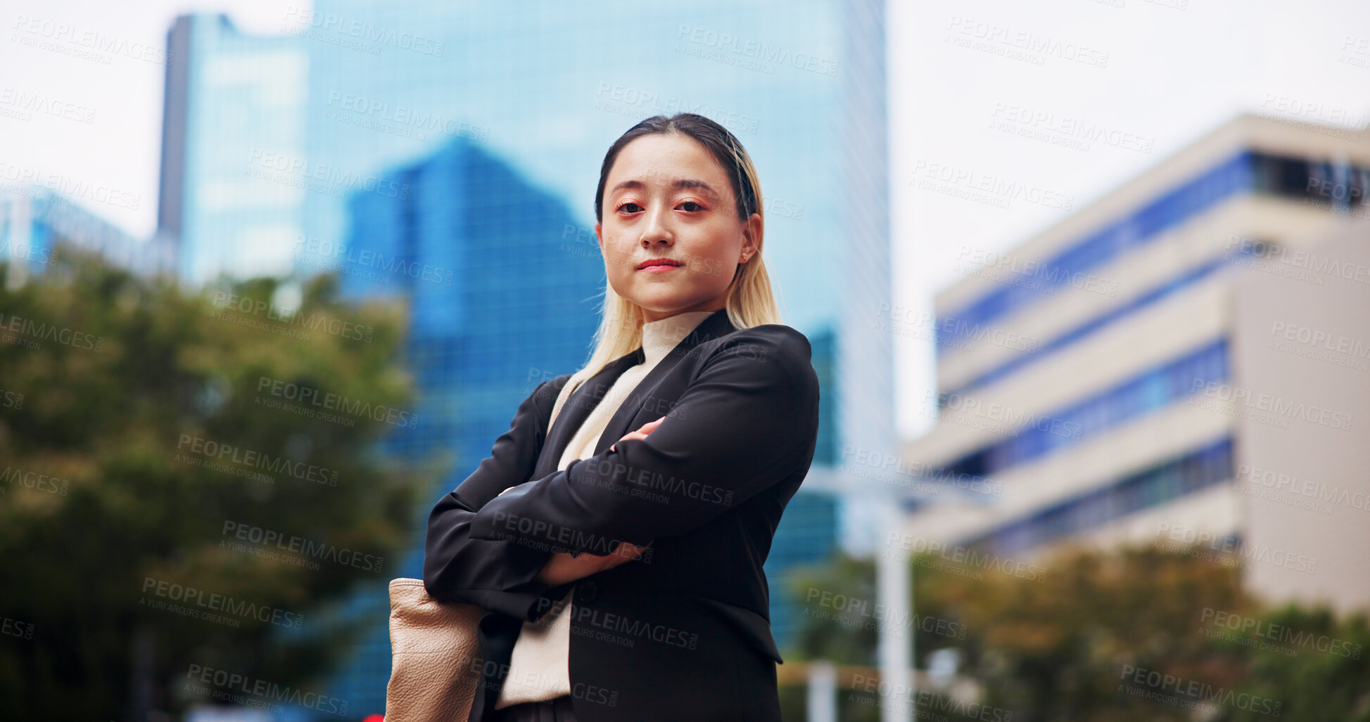 Buy stock photo Business, woman and arms crossed outdoor in city with commuting or travel to work in Japan. Female person, employee and confident or serious on portrait for career as accountant in downtown Tokyo