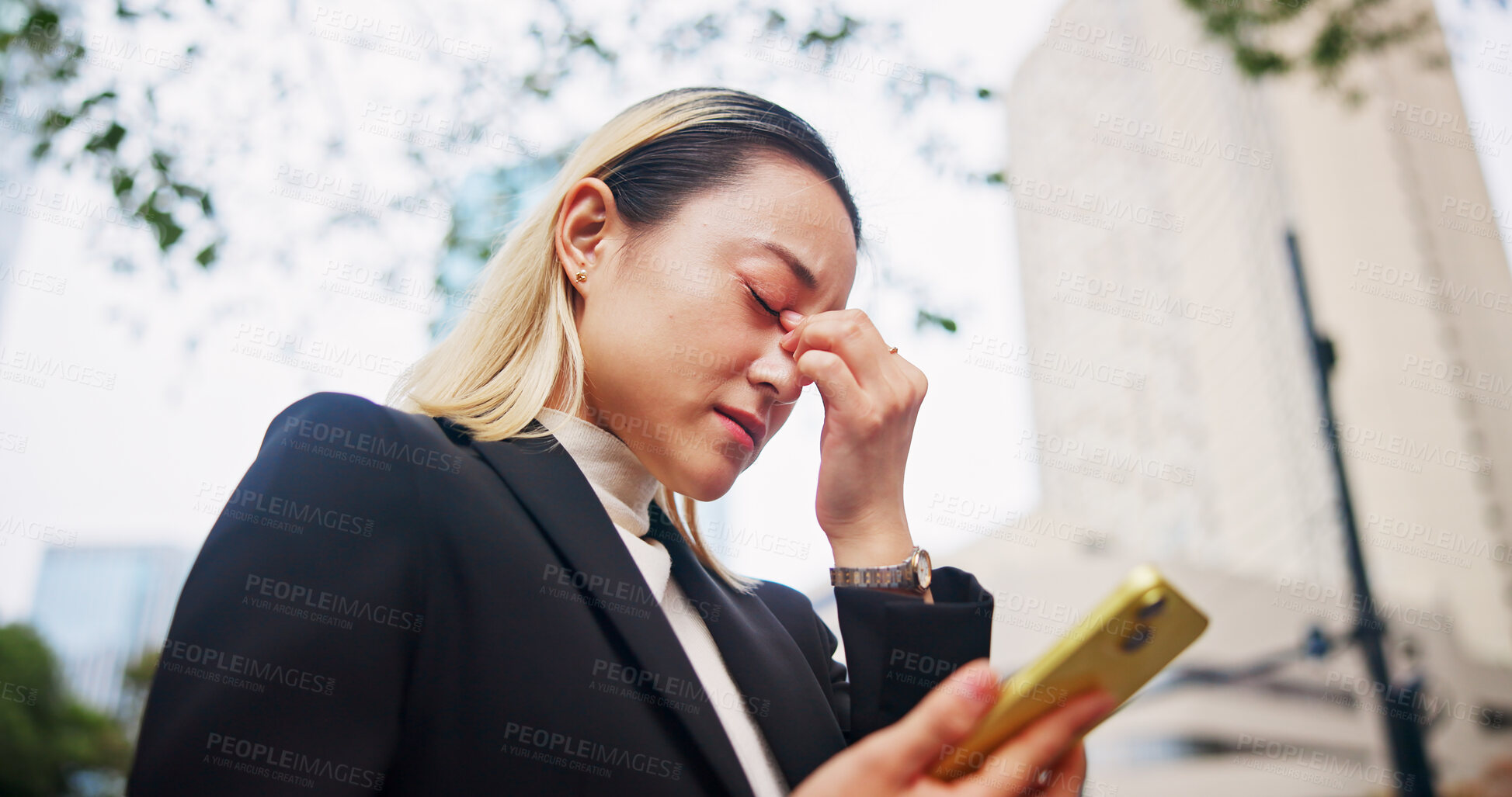 Buy stock photo Frustrated, asian woman or phone with headache in city for company bankruptcy, debt or mistake. Japan, female person or employee with migraine or mobile smartphone in strain, financial crisis or fail