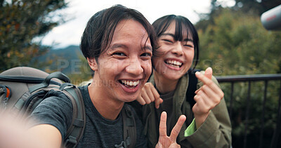 Buy stock photo Peace sign, selfie and smile with couple in nature for holiday, travel or vacation on mountains of Japan. Adventure, hiking and photograph with Japanese people outdoor on Mount Takao for memory