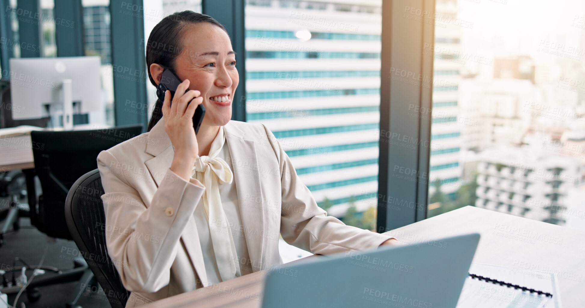 Buy stock photo Phone call, laptop and businesswoman in office with communication, networking or contact. Happy, cellphone and Japanese female financial advisor with mobile discussion for investment deal with client
