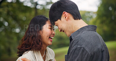 Buy stock photo Happy couple laugh, love and forehead touch outdoor for loyalty, funny or support together. Japanese man, woman and romantic relationship at park for connection, care or trust on valentines day date