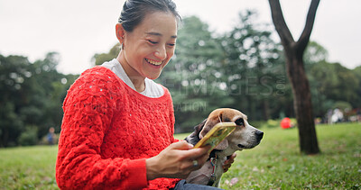 Buy stock photo Nature, phone and woman with dog in forest for bonding, companion and love for adoption. Happy, connection and Japanese female person with beagle puppy for pet outdoor in woods for playing together.
