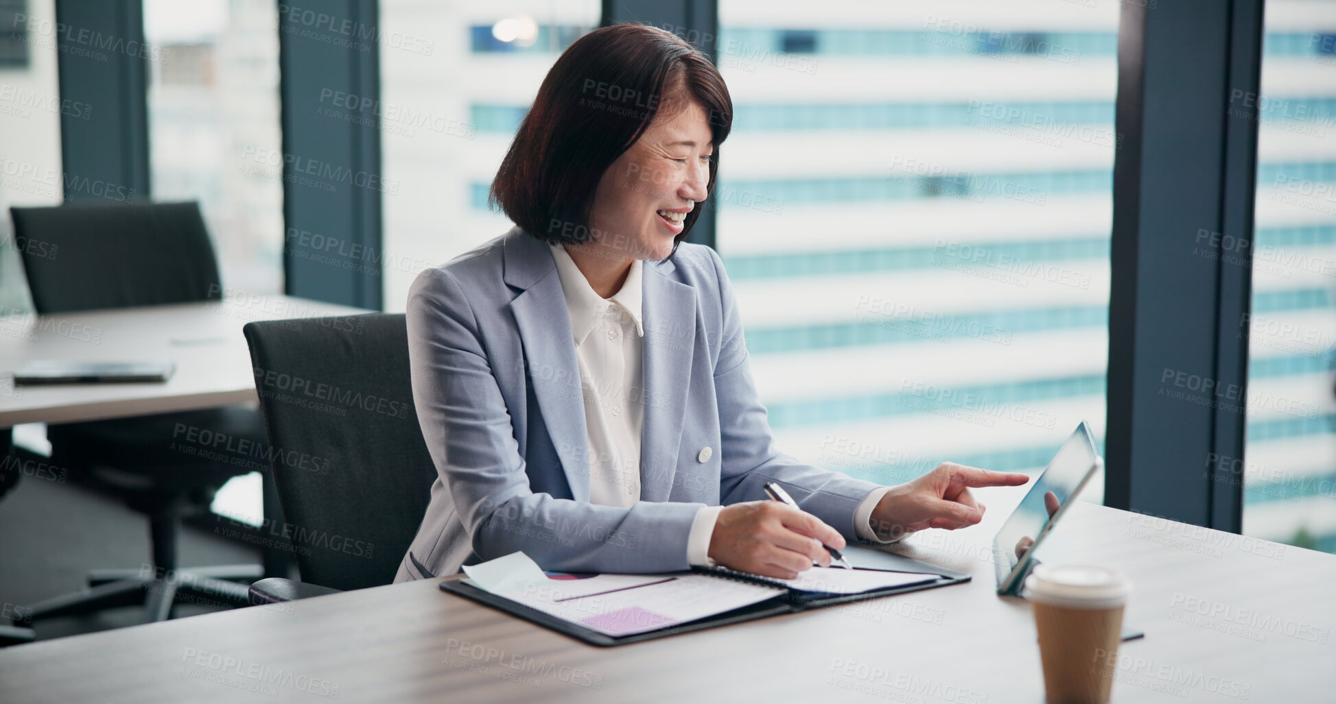 Buy stock photo Research, notes and woman in office with tablet, business plan or online schedule at desk. Scroll, search and Japanese businesswoman on digital app with financial report, smile and writing in folder