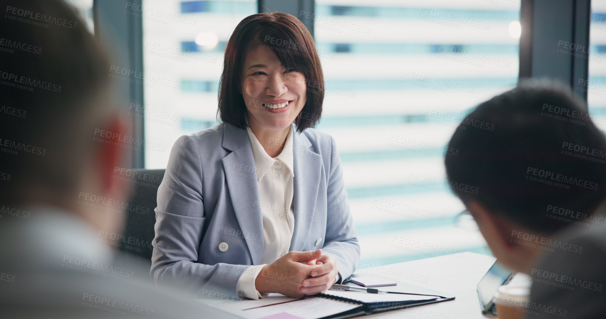 Buy stock photo Leader, business woman and team planning, meeting and problem solving in office. Japanese manager, smile and group brainstorming project, discussion and investment briefing for results or profit