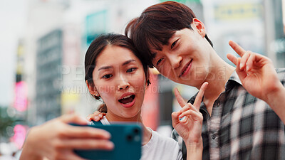 Buy stock photo City, peace sign and selfie with couple on street together in Japan for bonding, love or tourism. Emoji, photograph and smile of Japanese woman with man in urban town for holiday, travel or vacation