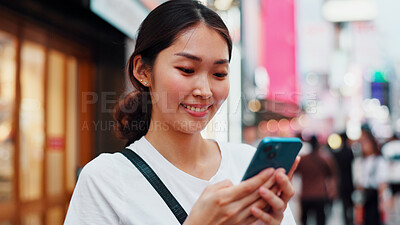 Buy stock photo Woman, phone and happy with travel in city, reading and check notification for chat, scroll or online in street. Girl, smartphone and search on metro sidewalk, smile and app for social media in Japan