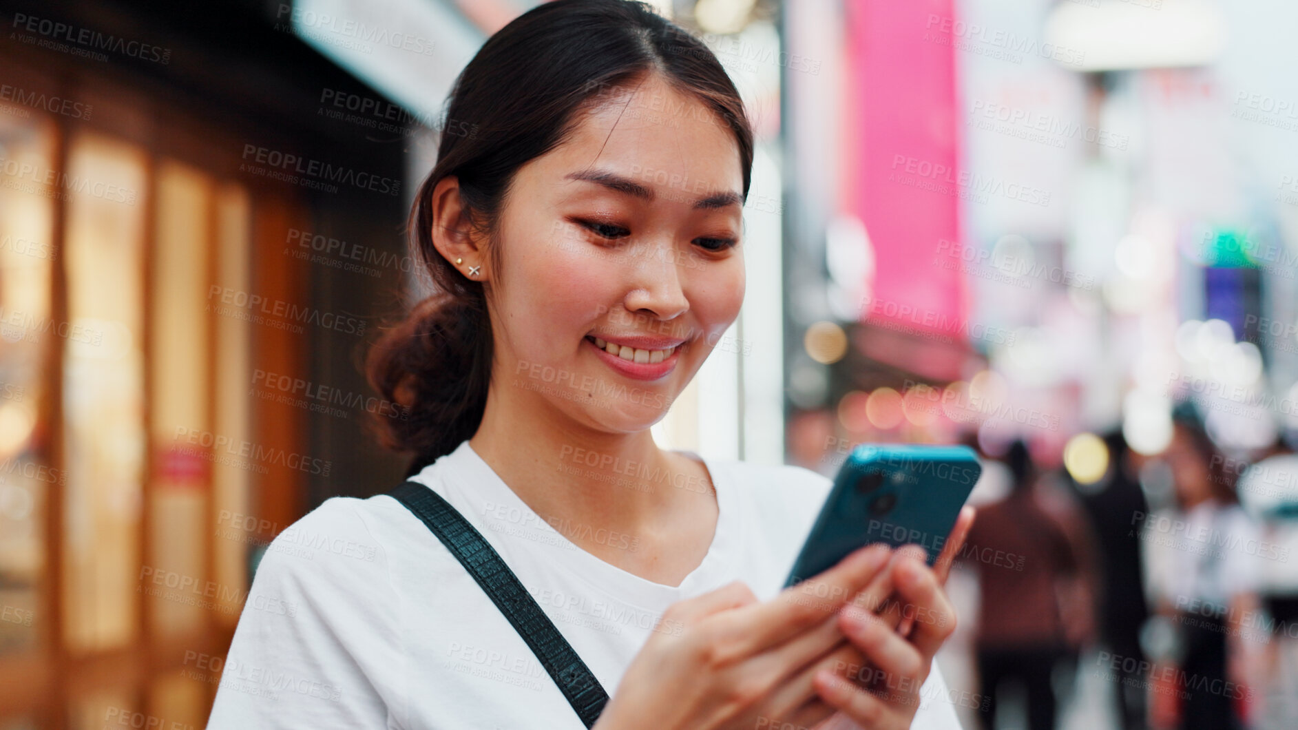 Buy stock photo Woman, phone and happy with travel in city, reading and check notification for chat, scroll or online in street. Girl, smartphone and search on metro sidewalk, smile and app for social media in Japan