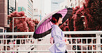 City, umbrella and woman in kimono walking on bridge with smile, morning travel or sightseeing adventure. Fashion, spring and Japanese girl in traditional clothes, parasol or culture on urban commute