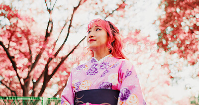 Buy stock photo Cherry blossom, park and girl in kimono, trees and thinking with outdoor sightseeing in nature in low angle. Culture, inspiration and Japanese woman in spring garden for traditional sakura festival