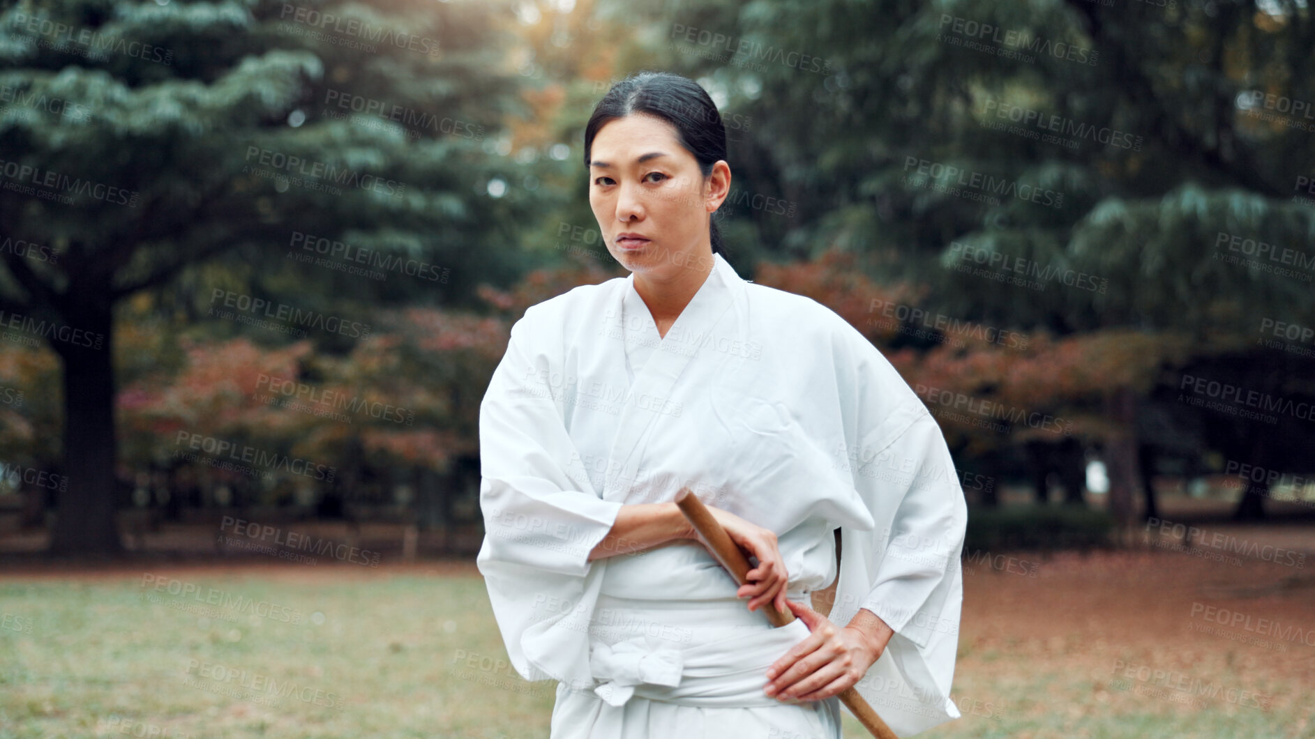 Buy stock photo Portrait, Japanese woman and outdoor for martial arts as athlete for training, exercise or stance. Female person, culture and ready for challenge, combat or practice for defence technique for bojutsu