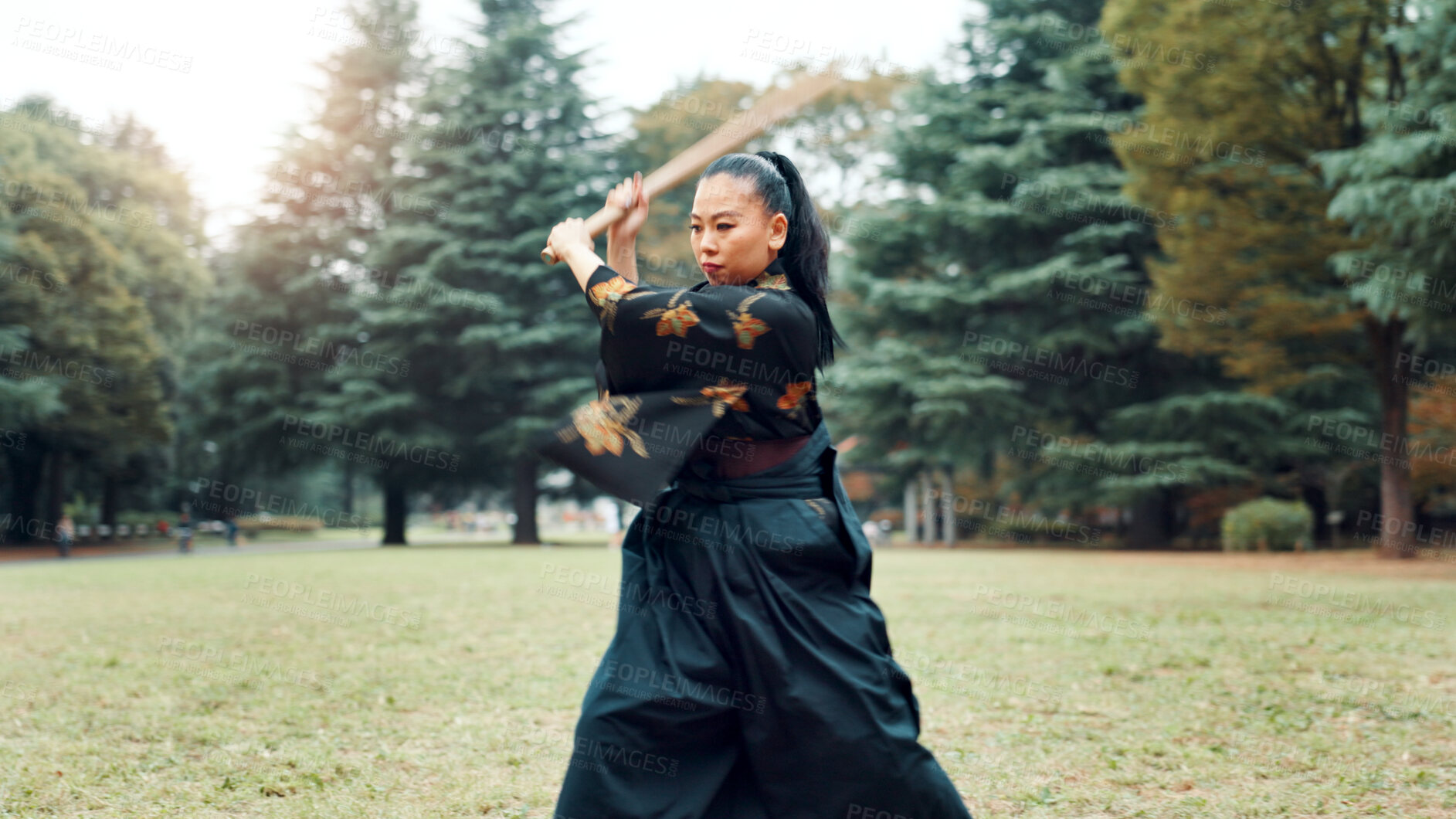 Buy stock photo Nature, training and Asian woman with bamboo sword in park for martial arts, Kendo practice and exercise. Culture, bokuto and person with shinai for skills, fitness and traditional sports in Japan