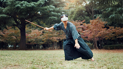 Buy stock photo Virtual reality, park and Asian man with bamboo sword for martial arts, Kendo practice and exercise. Culture, Japan heritage and person with shinai, VR tech and goggles for skills, fight and training