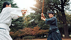 People, fight and sword in nature for kendo, demonstration movement or fitness challenge in Tokyo. Japanese martial arts, teacher or outdoor with bamboo for class, culture heritage or sport tradition