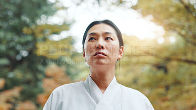 Buy stock photo Woman, thinking and reflection in nature for peace, idea and mindset for martial arts practice in Tokyo. Japanese samurai, daydreaming and relax in park with nostalgia, memories and culture in sport