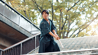 Buy stock photo City, bamboo sword and Asian man on stairs for martial arts, Kendo practice and exercise. Culture, heritage and person with shinai, bokuto and weapon for skill, fight or traditional training in Japan