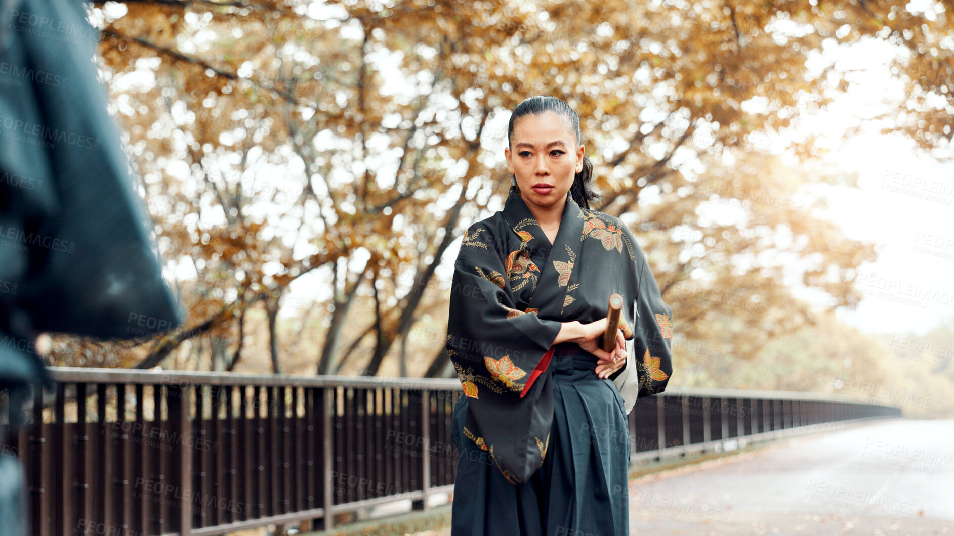 Buy stock photo Battle, fighter and woman with kimono, martial arts and weapon for training, outdoor and aikido. Woods, fitness and person with skills for bamboo sword, technique and discipline for kendo in Japan