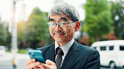 Buy stock photo Outdoor, businessman and happy with smartphone in city on social media for communication in Japan. Mature person, employee and smile or satisfied in downtown Tokyo on internet or email notification