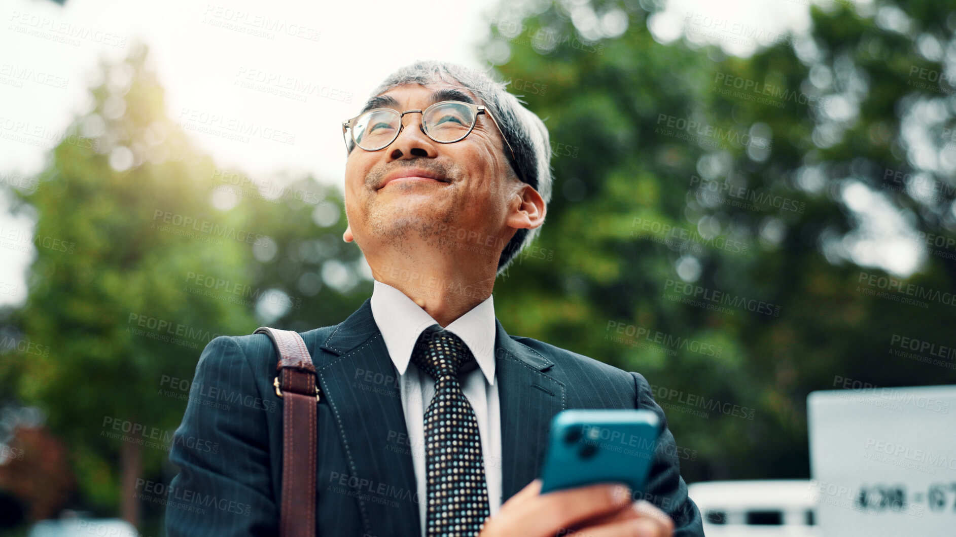 Buy stock photo Thinking, business and man with phone in city for communication, planning travel and schedule update. Mature, person and mobile app for corporate negotiation, location search and information in Japan