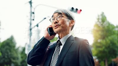 Buy stock photo Outdoor, phone call and business with mature man, travel and conversation with digital app. Asian person, employee or accountant in city, cellphone and chatting with communication, commute and Japan