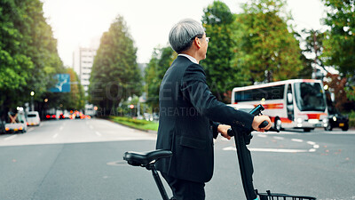 Buy stock photo Business, man and walking with e bike in city for sustainable transport, eco friendly and carbon neutral travel. Mature person, electric bicycle and morning commute, urban journey and Japan adventure