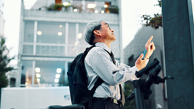 Buy stock photo Businessman, phone or electrical bike in street for travel, clean energy or sustainable transport. City commute, mature or eco friendly scooter with mobile app technology for location or map in Japan