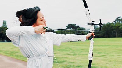 Buy stock photo Aim, athlete and woman with bow, challenge and serious for archery, training and equipment for game. Outdoor, skills and talent for sport, shooting and arrow for practice, archer and person in Japan